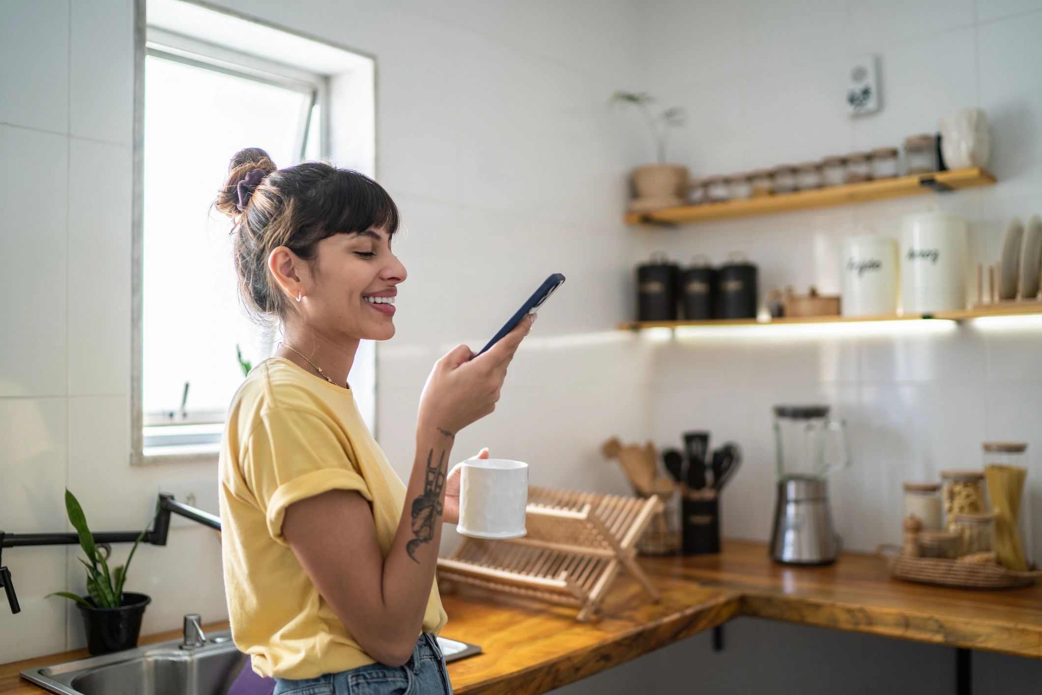 Person using a smartphone at home