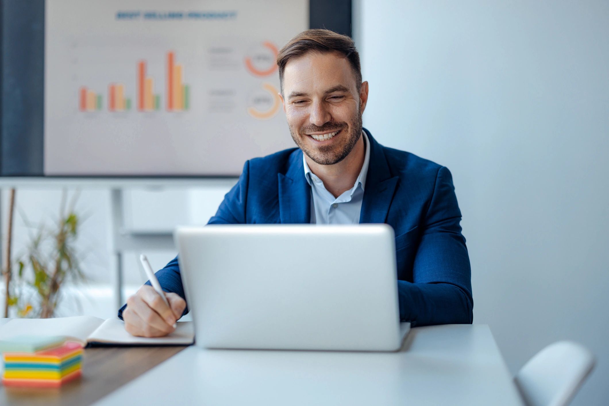 Professional working on a laptop representing business tech support